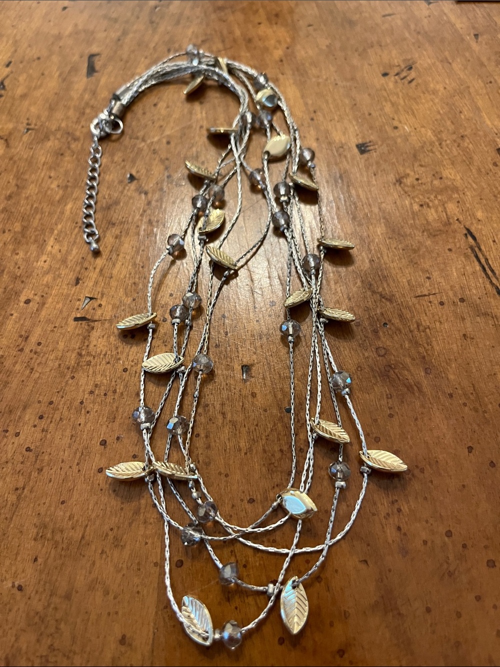Multi layer silver and gold toned leaf necklace